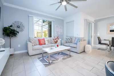 a living room with a couch and a table at Cozy home Near Disney Free resort Access 4463 in Kissimmee