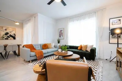 a living room with a couch and a table at Pro decor Disney Resort style FREE Waterpark 4467 in Kissimmee