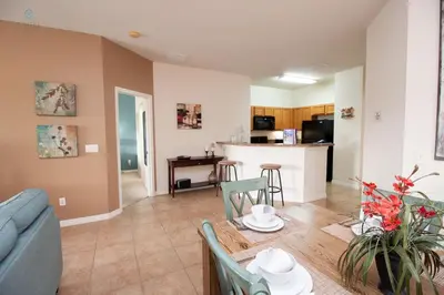 a living room with a couch and a table at Townhome at Oakwater Resort in Orlando