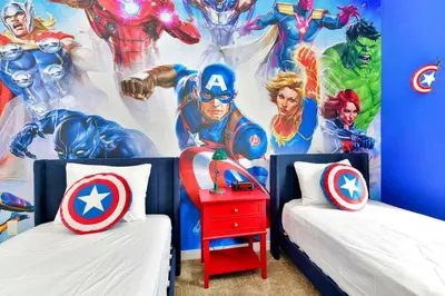 a bedroom with a superhero mural on the wall at New Towhouse 2025 in Orlando