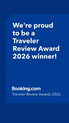 a blue sign that says were proud to be a traveler reviewagency winner at Three-Bedroom House in Clear Creek in Orlando