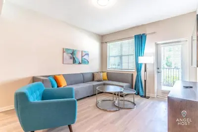 a living room with a couch and a table at Apartment at Vista Cay Resort in Orlando