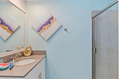 a bathroom with a sink and a shower at 2452 Reading Trail in Kissimmee