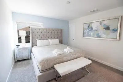 a bedroom with a large bed and a window at Private Pool Townhome at Storey Lake Resort in Kissimmee