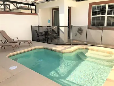 a swimming pool in the middle of a house at Private Pool Townhome at Storey Lake Resort in Kissimmee