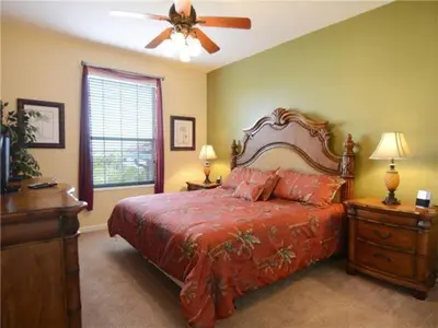a bedroom with a bed and a ceiling fan at Apartment at Vista Cay Resort in Orlando