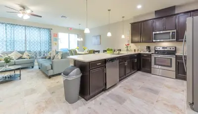an open kitchen and living room in a house at Townhome at Compass Bay Community in Kissimmee
