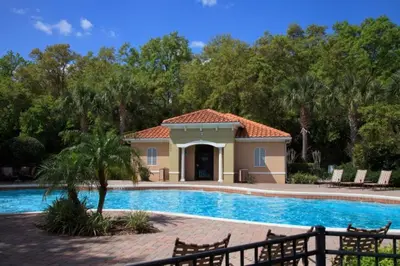 a villa with a swimming pool and a house at Townhome at Compass Bay Community in Kissimmee