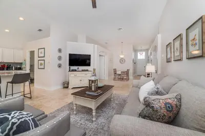 a living room with a couch and a table at Private Pool Home at Windsor Palms Resort in Kissimmee