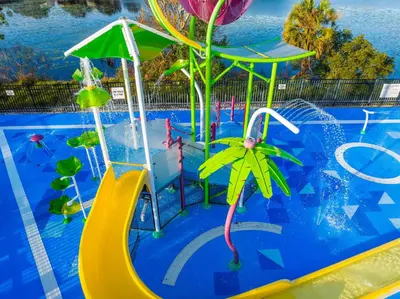 a swimming pool with a water park with a slide at Sunny Condo Retreat at Windsor Hills in Orlando