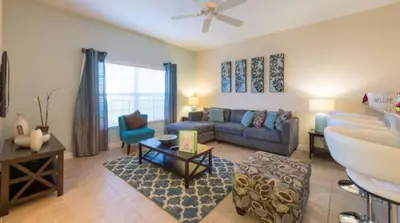 a living room with a couch and a sink at Private Pool Townhome at Paradise Palms Resort in Kissimmee