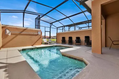 a swimming pool in a building with a glass roof at 3069 Beach Palm in Kissimmee