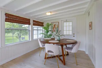 a dining room with a wooden table and chairs at Hope Home in Clermont