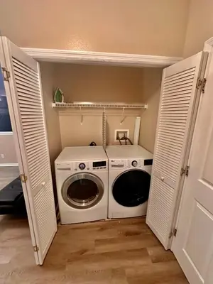 a washer and dryer in a small room at Grand Holiday 3BR Condo Resort near Disney Parks in Kissimmee