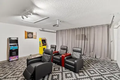 a room with four chairs and a video game at 4676 Cumbrian Lakes in Kissimmee