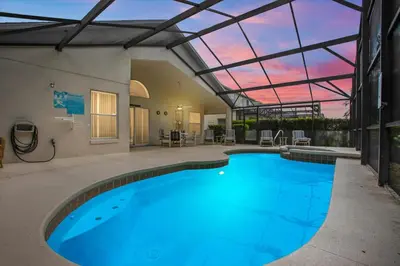 a large swimming pool with a glass ceiling at 4676 Cumbrian Lakes in Kissimmee