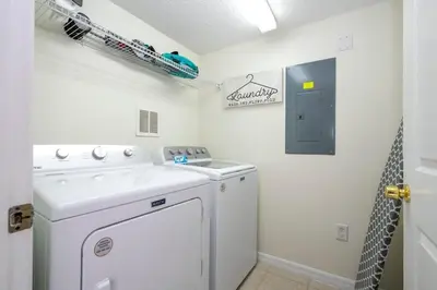 a white laundry room with a washer and dryer at Marvelous 3Bd w Jacuzzi at Terra Verde Resort 4757 in Kissimmee