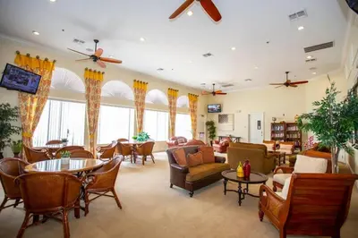 a large living room with chairs and tables at Marvelous 3Bd w Jacuzzi at Terra Verde Resort 4757 in Kissimmee