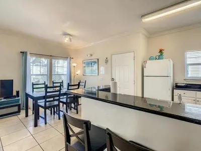 a kitchen with a table and chairs and a refrigerator at LV2950-105LHC - 4 bedrooms - Lucaya Resort in Kissimmee