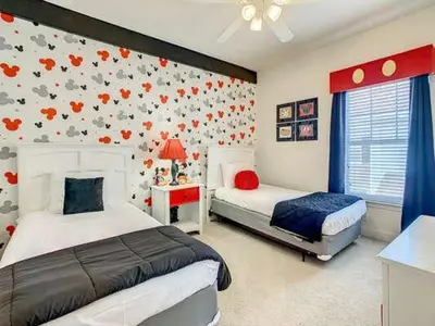 a bedroom with two beds and a wall with birds at LV2950-105LHC - 4 bedrooms - Lucaya Resort in Kissimmee