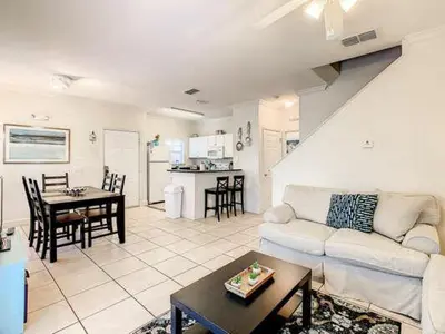 a living room with a couch and a table at LV2950-105LHC - 4 bedrooms - Lucaya Resort in Kissimmee