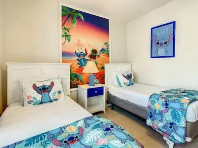 a bedroom with two beds and a painting on the wall at LV2950-105LHC - 4 bedrooms - Lucaya Resort in Kissimmee