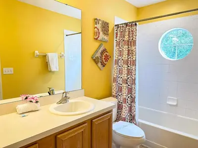 a bathroom with a sink and a toilet and a shower at EIR8505PH - Emerald's paradise by Disney in Kissimmee