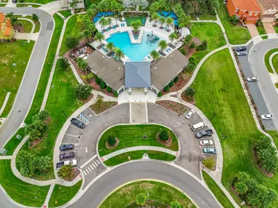 an aerial view of a parking lot with a pool at Tranquility Hut, Spacious 4-bedrooms, 4-bathrooms, Pools, free parking in Kissimmee