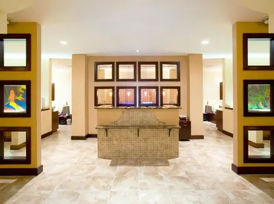 a lobby with a fireplace in the middle of a building at Best Disney Resort Condo Orlando in Orlando