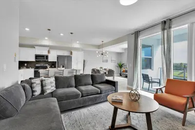 a living room with a couch and a table at 3151 Paradox #306 in Kissimmee