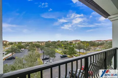 a balcony with a view of a parking lot at The Epic Edinburgh Top Floor Vista Cay Orlando in Orlando