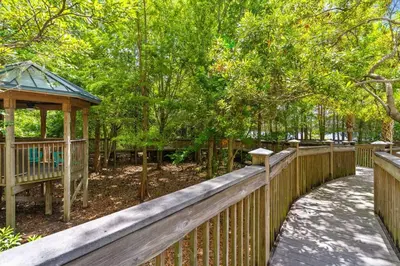 a wooden fence with a gazebo in a park at Lakeview newly renovated condo near Disney in Orlando