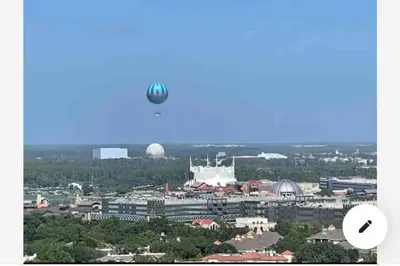 a hot air balloon in the sky over a city at Lakeview newly renovated condo near Disney in Orlando