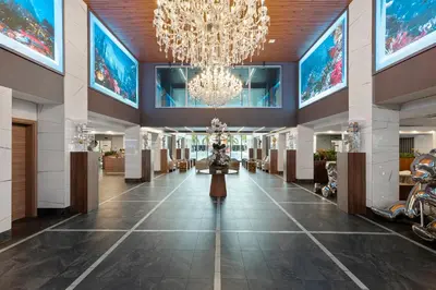 a large hallway with a chandelier and a lobby at Kompose Boutique Resort @ Theme Parks in Kissimmee