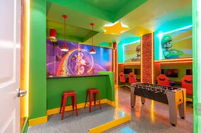 a childrens play room with a table and stools at 6163 Fantastic Home with 12BD in Orlando