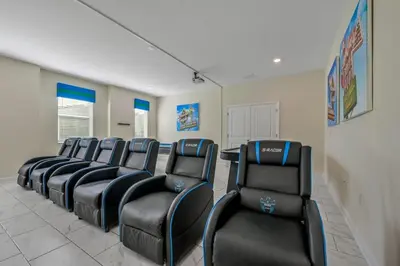 a row of empty chairs in a waiting room at Charming Home Ideal Location Spacious Game Room in Kissimmee