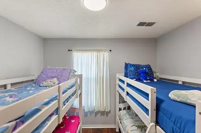 a bedroom with two bunk beds and a blue teddy bear at Serene Stay at Terra Verde Resort by Shine Villas 111 townhouse in Kissimmee