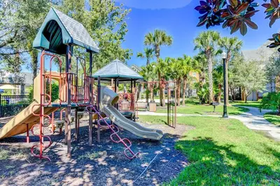 a playground with a slide in a park at Orlando Retreat 2B2B / Disney-Universal-SeaWorld in Orlando