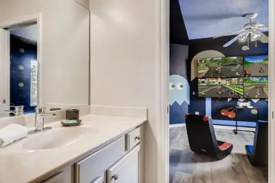 a bathroom with a sink and a play room at Lakefront 6BR Resort Pool Home Near Disney in Kissimmee