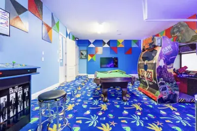 a room with a pool table and a bar at Enchanting a Magical Orlando Trip in Kissimmee