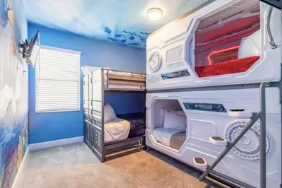 a bedroom with two bunk beds in a room at Enchanting a Magical Orlando Trip in Kissimmee