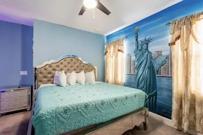 a bedroom with the statue of liberty painted on the wall at Enchanting a Magical Orlando Trip in Kissimmee