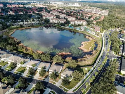 an aerial view of a lake in a subdivision at This amazing 6 Bedroom property with a lake view in Orlando