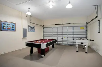 a ping pong room with a pool table in it at Tropical and peaceful, this 5 bed with Pool & Spa in Orlando