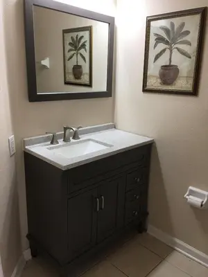 a bathroom with a sink and a mirror at Resort 5 Bed Private Pool & Spa, Game Room Home in Kissimmee