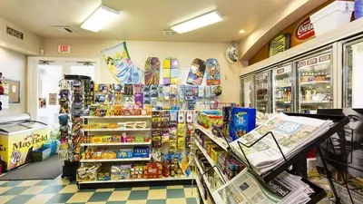 a store aisle with a grocery store with food and drinks at Resort 5 Bed Private Pool & Spa, Game Room Home in Kissimmee