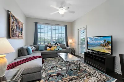 a living room with a couch and a flat screen tv at Windsor Palms 3 bed Condo in Gated Resort in Kissimmee