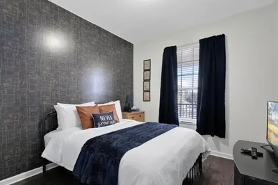 a bedroom with a large bed and a window at Windsor Palms 3 bed Condo in Gated Resort in Kissimmee