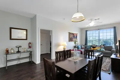 a dining room and living room with a dining table at Windsor Palms 3 bed Condo in Gated Resort in Kissimmee
