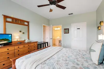a bedroom with a bed and a ceiling fan at Close to Disney Condo 3 Bed / 2 Bath in Kissimmee